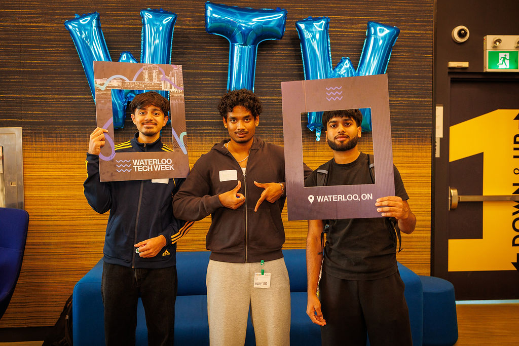Waterloo Tech Week 2025 | BetaKit Three young people pose with props at Waterloo Tech Week